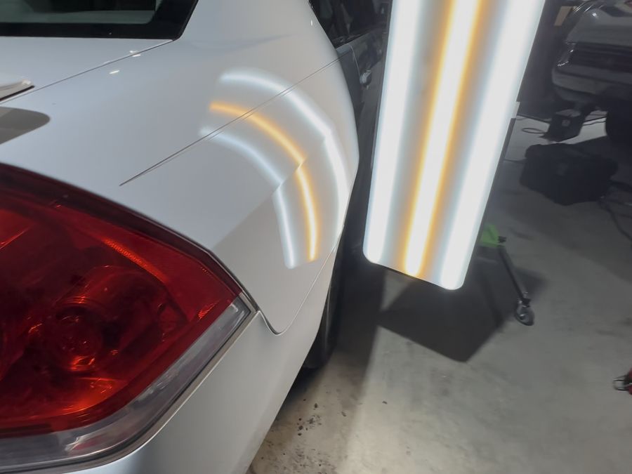 Same fender after paintless dent repair
